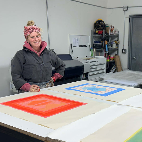 Image of Lily Stockman in the studio featuring a suite of prints titled the Geminid Prints