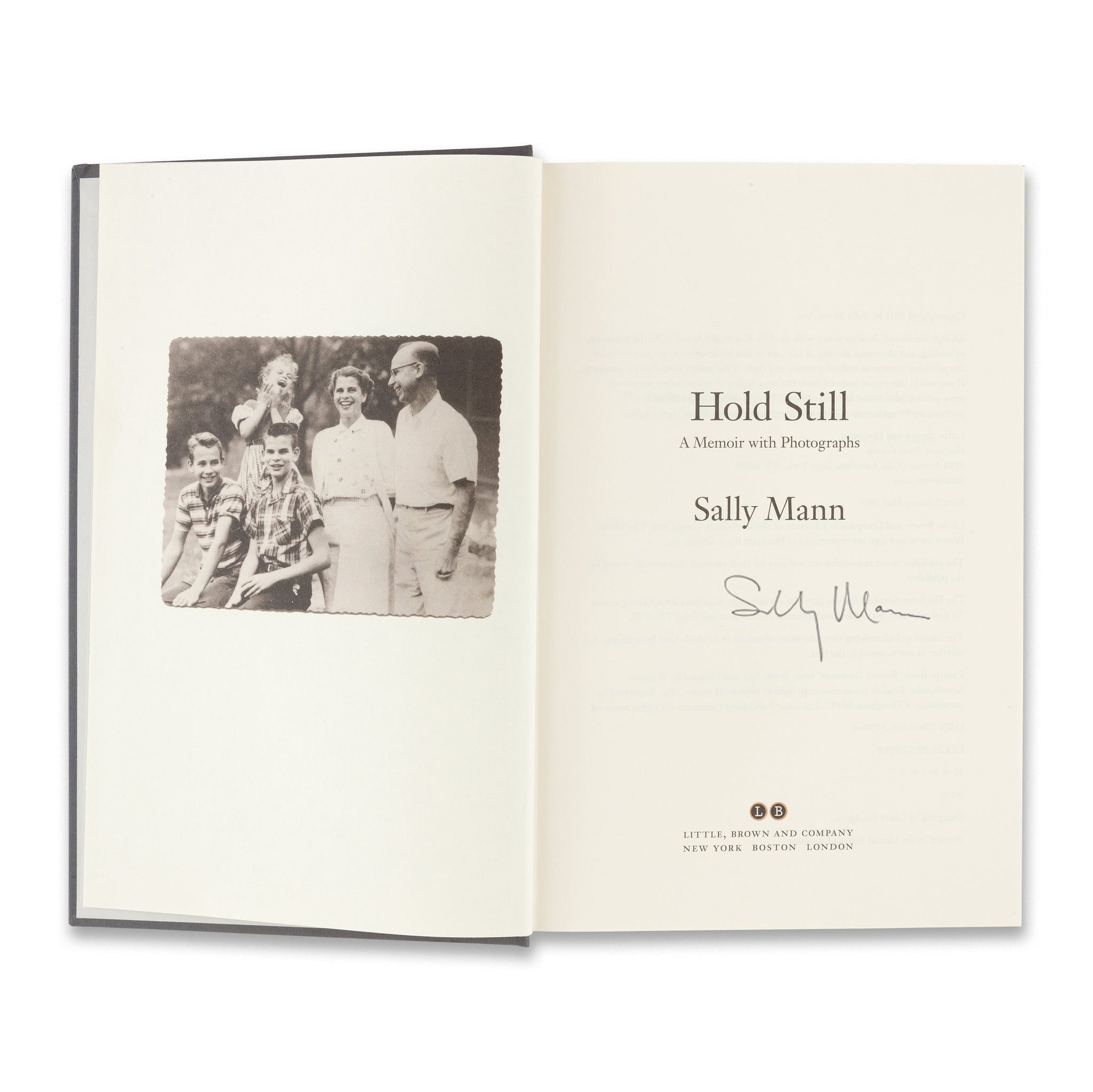 Title page of the book Sally Mann: Hold Still with artist signature